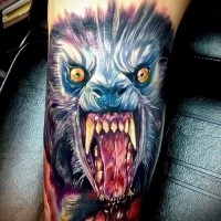 Terrifying colored arm tattoo of bloody wolf face