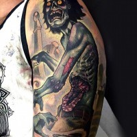 Terrifying colored detailed shoulder tattoo of zombie in cemetery