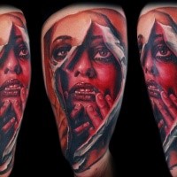 terrifying colored tattoo of ripped woman portrait