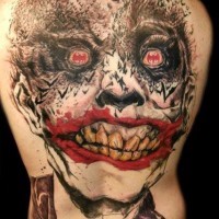 Terrifying huge whole back stylized colored Joker tattoo with bats shaped eyeballs