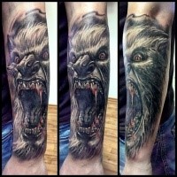 Terrifying looking colored arm tattoo fo bloody wolverine