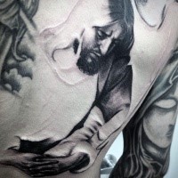 Thoughtful Jesus Christ unfinished work religious tattoo on back