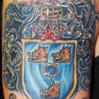 Three boar family crest tattoo on arm