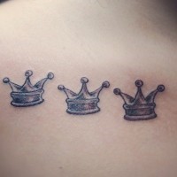 Three little pretty crown tattoo on back