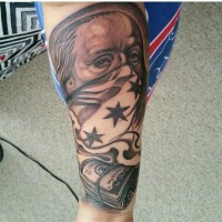 Thug style black ink American native forearm portrait tattoo with money bills