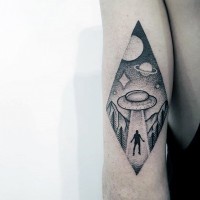 Tiny black and white alien ship stealing the human tattoo on arm