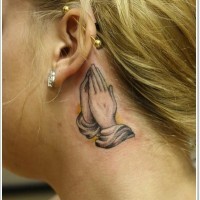 Tiny black and white praying hands tattoo on neck