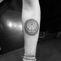 Tiny black ink forearm tattoo of geometrical symbol