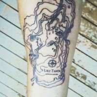 Tiny black ink simple forearm tattoo of map part with lettering