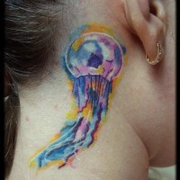 Tiny multicolored jelly-fish tattoo on neck