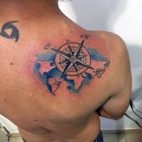 Tiny nautical themed colored world map tattoo on shoulder
