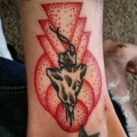 Tiny old school style black ink arrow head tattoo with red colored geometrical figures