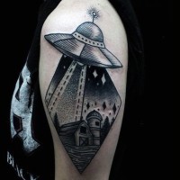 Tiny old school style painted black ink alien ship with farm tattoo on shoulder