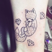 Tiny simple black ink fox tattoo on ankle combined with diamonds