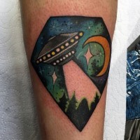 Tiny simple painted and colored alien ship in night sky tattoo on leg