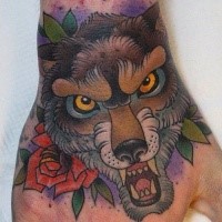 Traditional furious wolf and red rose flower colored hand tattoo with violet shadow