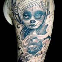 Traditional painted colored Mexican girl with toy tattoo on arm