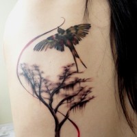 Tree and swallow tattoo on back