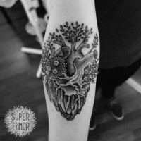 Tree grown out of heart forearm tattoo by Super Timor