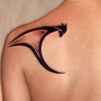 Tribal black ink dragon tattoo shoulder blade
