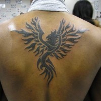 Tribal phoenix tattoo on back