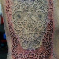 tribale stile 3D dettagliato a forma di  cranio messicano tatuaggio su costolette