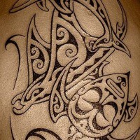 Tribal style big black and white ocean animals tattoo on upper arm
