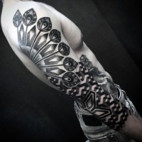 Tribal style black and white ornaments tattoo on sleeve