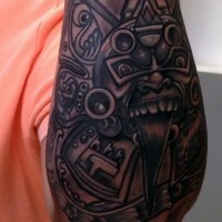 Tribal style ornaments tattoo on forearm