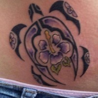 Tribal turtle and hibiscus flower tattoo on stomach