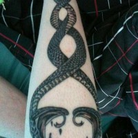 Two intertwined snakes tattoo