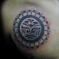 Typical black and white chest tattoo of circle shaped emblem