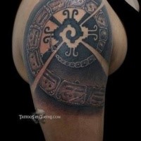 Typical black and white shoulder tattoo of antic symbols