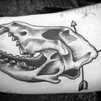 Typical black ink animal skull tattoo with arrows