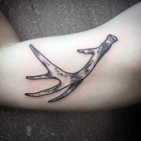Typical black ink biceps tattoo of deer horn