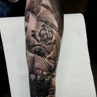 Typical black ink detailed arm tattoo of big pirate sailing ship