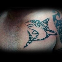 Typical black ink Polynesian style chest tattoo of evil shark