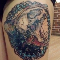 Typical colored illustrative style thigh tattoo of little animal skull with space star