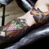 Typical colored old school sleeve tattoo of rhino head and owl