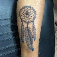 Typical colored tattoo of dream catcher with feather