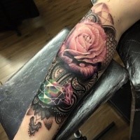 Typical combined and colored forearm tattoo of rose with diamond and ornaments