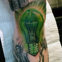 Typical illustrative style arm tattoo of green bulb