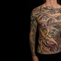 Typical multicolored sleeve, chest and belly tattoo of alien bones