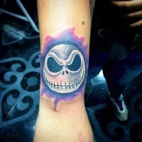 Typical neo traditional style wrist tattoo of Nightmare before Christmas hero head