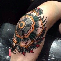Typical old school style knee tattoo of plane with flowers