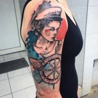 Typical sketch style colored shoulder tattoo of sailor woman with ships steering wheel