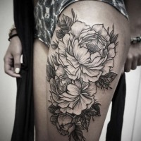 Typical style painted big black and white flowers tattoo on thigh