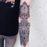 Typical very detailed sleeve tattoo of Hinduism ornaments