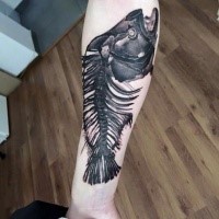 Unbelievable black ink realism style fish skeleton tattoo on forearm