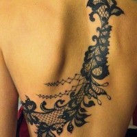 Unbelievable detailed big black ink floral tattoo on upper back